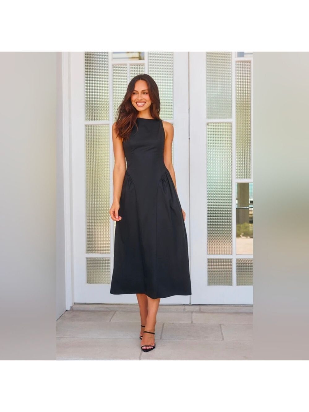 Calvin Klein sleeveless black fit-and-flare midi dress. Size 6